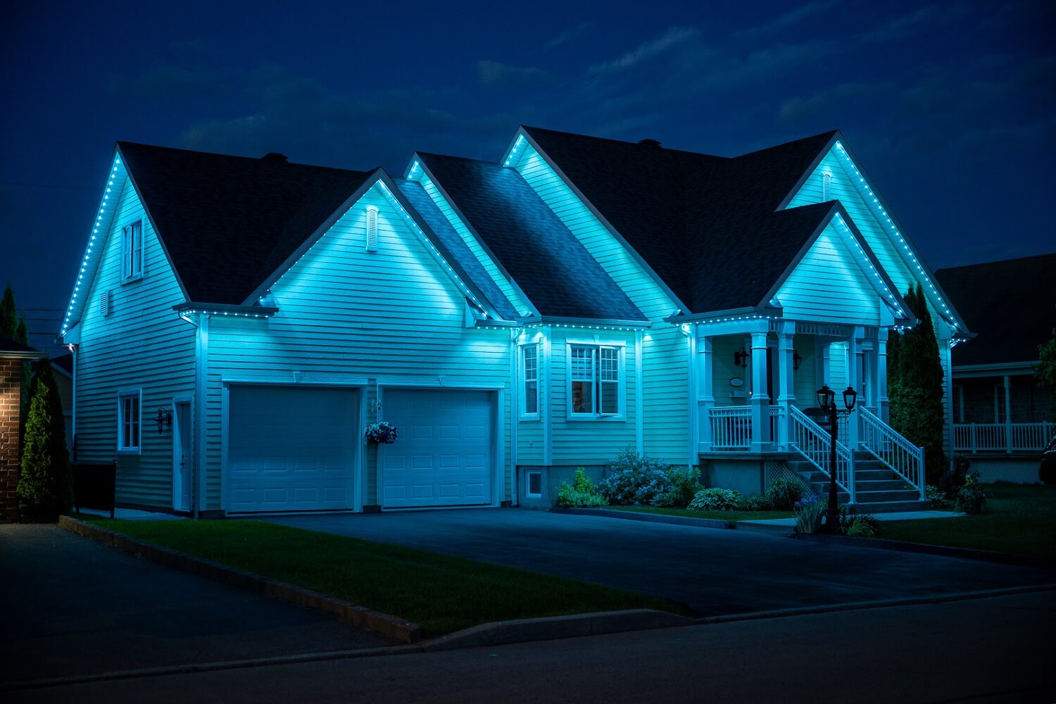 Home lit entirely in bright cyan