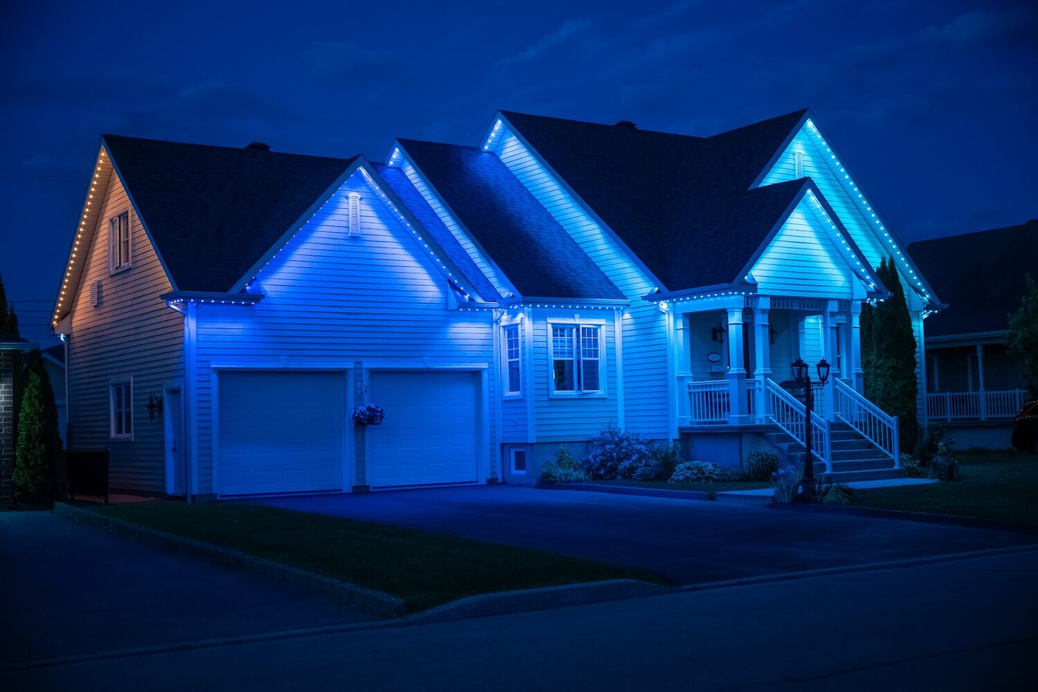 Home lit in saturated jewel colours on each roof section