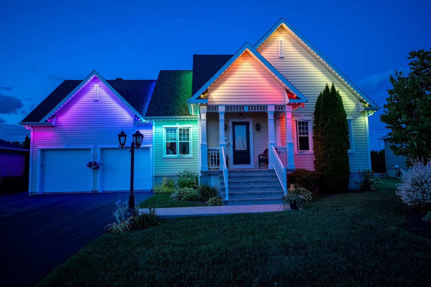 Home with each roofline section lit a different colour across a full spectrum