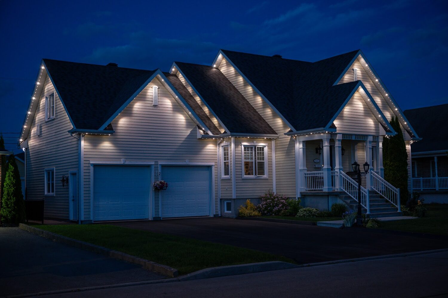 Home lit in white with evenly spaced lamps reading as pot lights