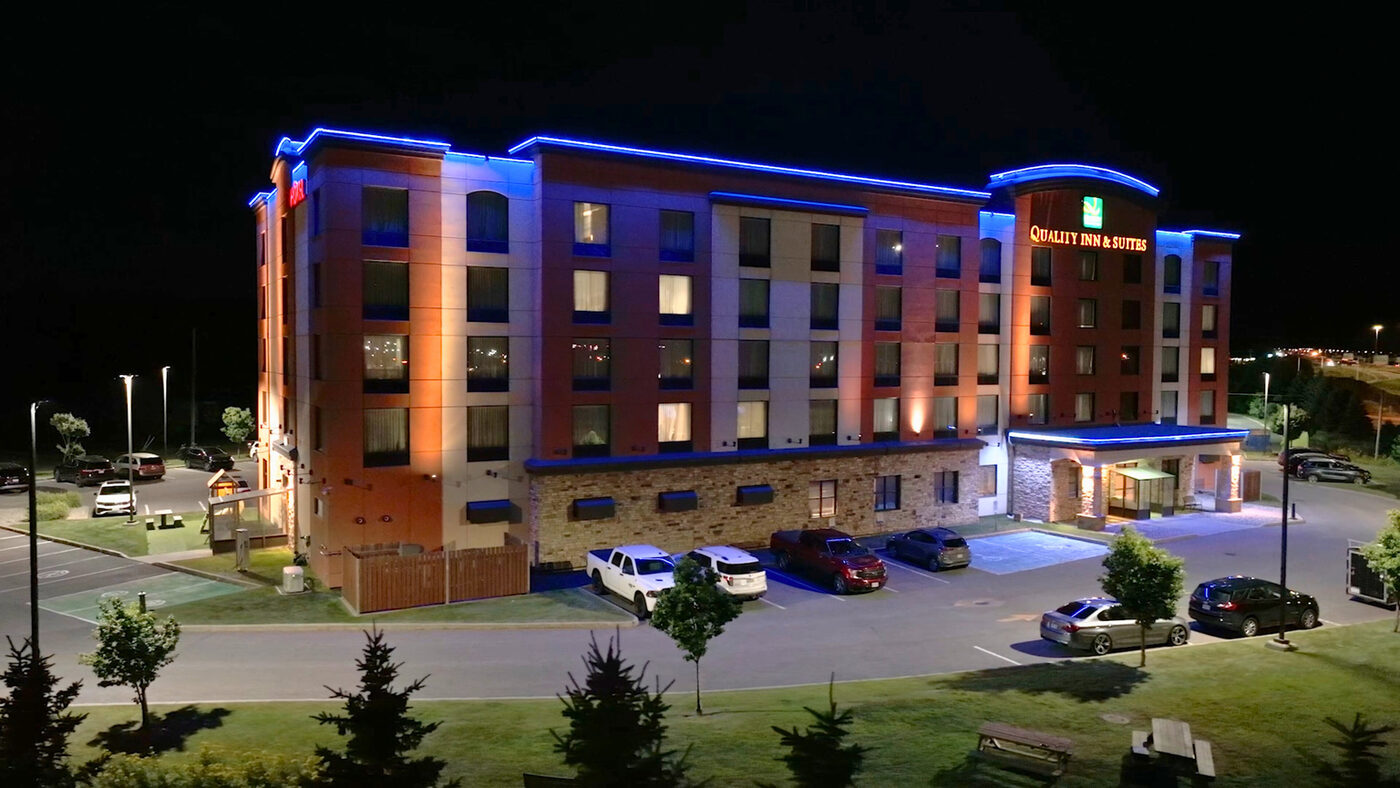 Apartment building lit at night in winter