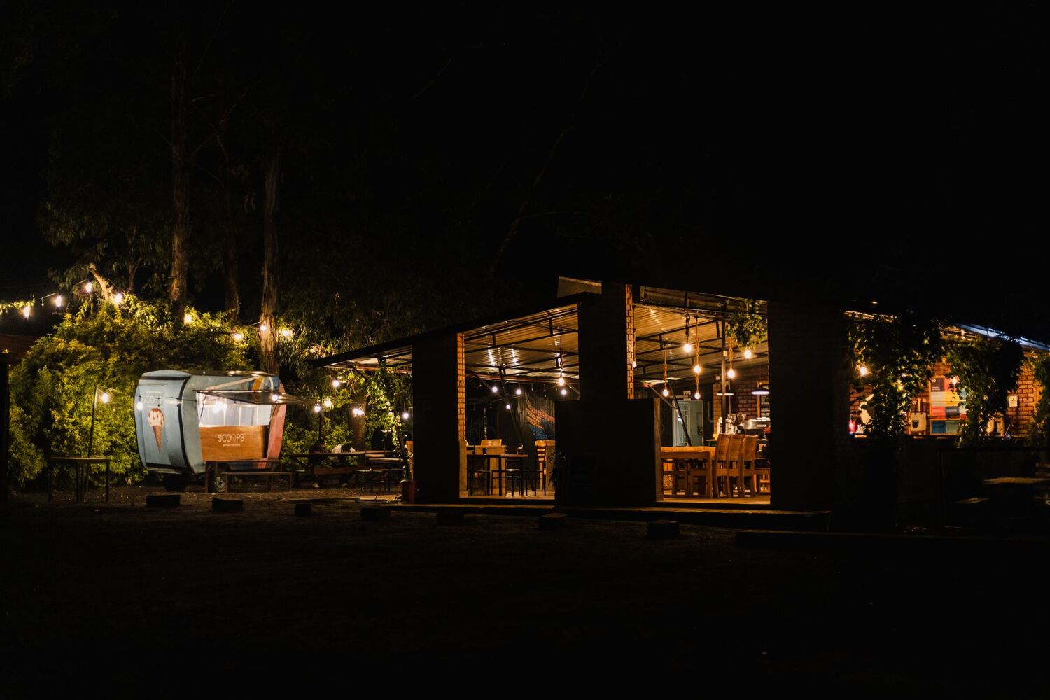 Outdoor restaurant patio lit with warm string lighting