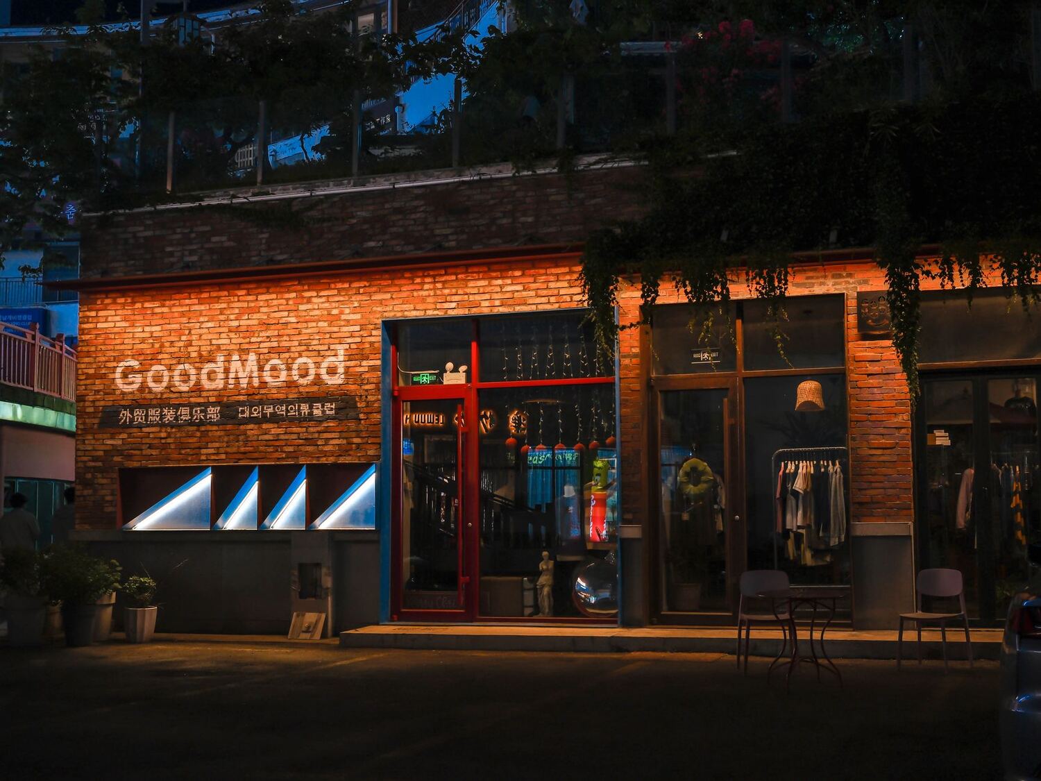 Boutique storefront lit warmly at night