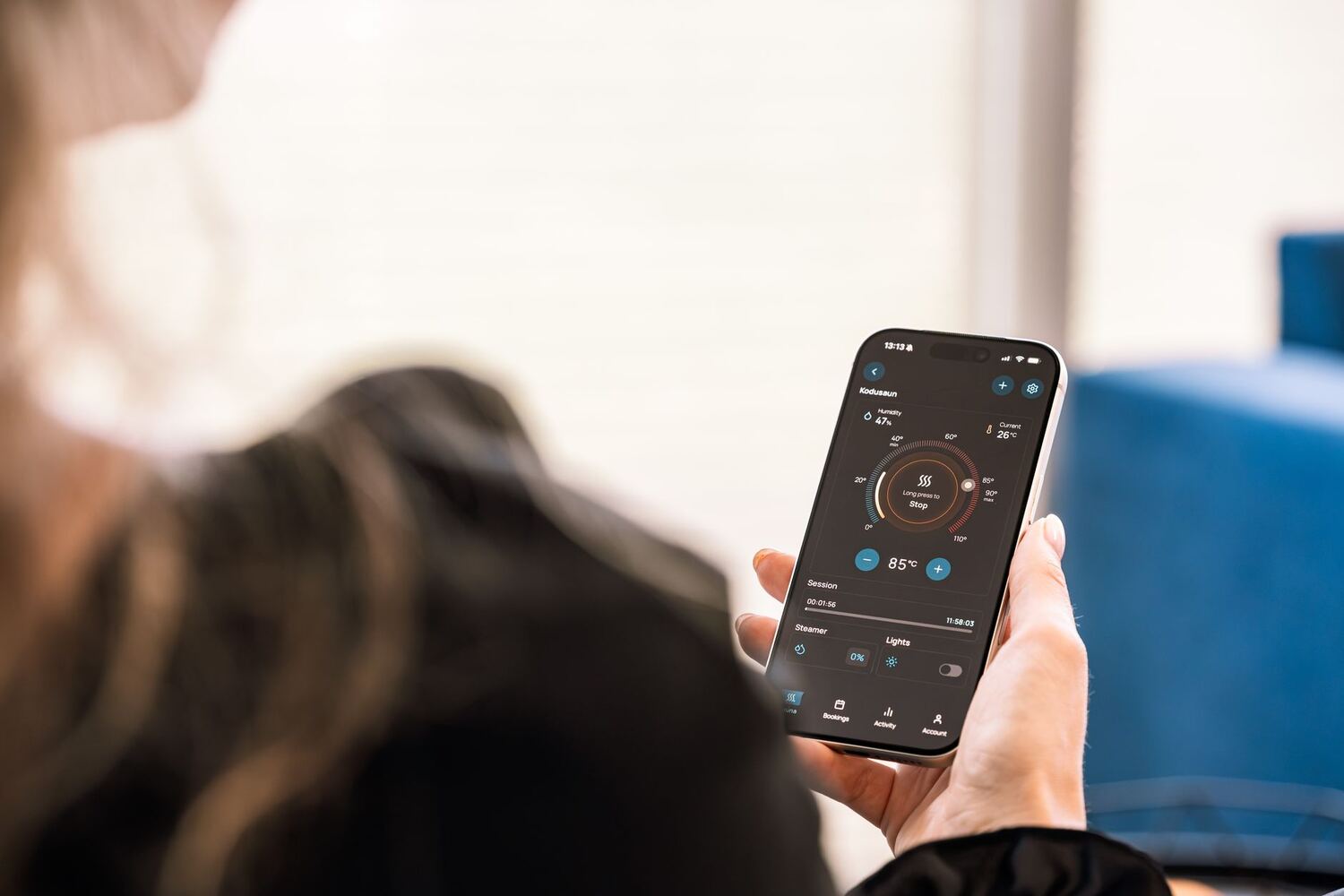 Person controlling lighting from a phone app